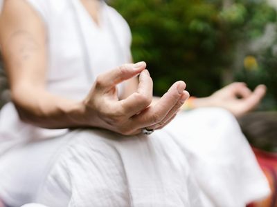 Close up of hands in a mudra position