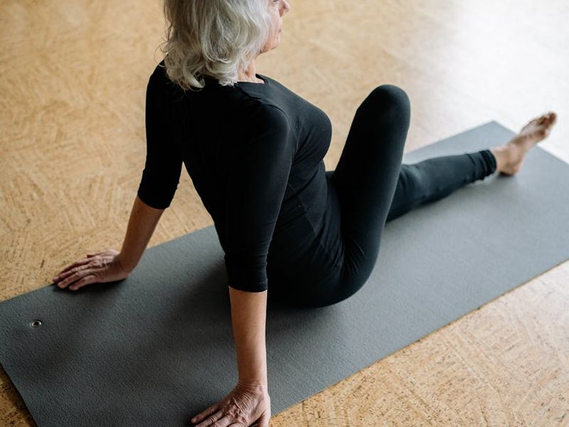 Person doing gentle yoga stretches on a mat